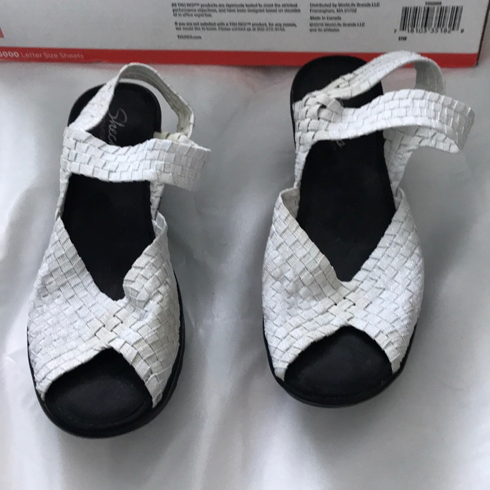White and black Skechers sandal wedges